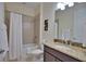 Clean bathroom with tub, shower, and granite vanity at 140 Maraviya Blvd, Nokomis, FL 34275