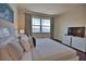 Main bedroom with king-size bed and stunning water views at 140 Maraviya Blvd, Nokomis, FL 34275