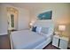 Guest bedroom with king-size bed and ensuite bathroom access at 140 Maraviya Blvd, Nokomis, FL 34275