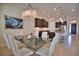 Spacious dining area with a glass-top table and white chairs at 140 Maraviya Blvd, Nokomis, FL 34275