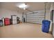 Clean and organized garage with open door at 140 Maraviya Blvd, Nokomis, FL 34275