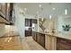 Modern kitchen features granite countertops, stainless steel appliances, and ample cabinetry at 140 Maraviya Blvd, Nokomis, FL 34275