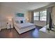 Bright bedroom with king-size bed, water view, and ample natural light at 140 Maraviya Blvd, Nokomis, FL 34275