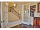 Home office with hardwood floors and French doors opening to the entryway at 140 Maraviya Blvd, Nokomis, FL 34275