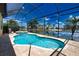 Inviting freeform pool with spa and screened enclosure at 140 Maraviya Blvd, Nokomis, FL 34275
