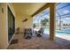 Spacious pool and patio area with lake views at 140 Maraviya Blvd, Nokomis, FL 34275
