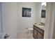 Powder room features granite vanity and toilet at 140 Maraviya Blvd, Nokomis, FL 34275