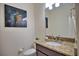 Convenient powder room with granite vanity at 140 Maraviya Blvd, Nokomis, FL 34275