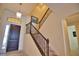 Elegant staircase with wrought iron railing at 140 Maraviya Blvd, Nokomis, FL 34275
