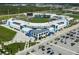 Aerial view of a modern baseball stadium with pristine field and parking at 1678 Quail Lake Dr, Venice, FL 34293
