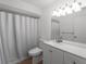 Well-lit bathroom with a shower and vanity with cabinets, and large mirror at 1678 Quail Lake Dr, Venice, FL 34293