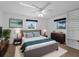 Bedroom featuring a neutral color palette, area rug, and natural light at 1678 Quail Lake Dr, Venice, FL 34293