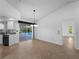 Bright dining area features neutral decor, tile flooring, and sliding glass doors to the screened pool at 1678 Quail Lake Dr, Venice, FL 34293
