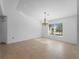 Well-lit dining room with tile floors and a large window offering natural light at 1678 Quail Lake Dr, Venice, FL 34293