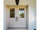 Double front doors with beveled glass inserts at 1678 Quail Lake Dr, Venice, FL 34293