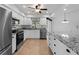 Charming kitchen features updated appliances, granite counters, and a window view at 1678 Quail Lake Dr, Venice, FL 34293