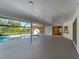 An ample covered patio featuring a ceiling fan and views of the backyard pool at 1678 Quail Lake Dr, Venice, FL 34293
