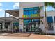 Exterior of Oak & Stone restaurant featuring ample windows and outdoor seating at 1678 Quail Lake Dr, Venice, FL 34293