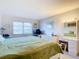 Bright bedroom with a king-size bed and plenty of natural light at 200 The Esplanade N # A7, Venice, FL 34285