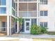 Condo building showcasing well-maintained exterior with lush landscaping at 200 The Esplanade N # A7, Venice, FL 34285