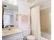 Clean bathroom with a toilet, shower/tub combo and a vanity at 21405 Olean Blvd # 404, Port Charlotte, FL 33952
