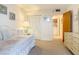 Bedroom with daybed, dresser, and access to laundry room at 21405 Olean Blvd # 404, Port Charlotte, FL 33952