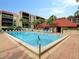 Refreshing community pool with ample lounge chairs at 21405 Olean Blvd # 404, Port Charlotte, FL 33952