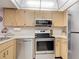 Kitchen with stainless steel appliances at 21405 Olean Blvd # 404, Port Charlotte, FL 33952