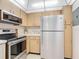 Stainless steel appliances, wood cabinets at 21405 Olean Blvd # 404, Port Charlotte, FL 33952