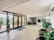 Building lobby with seating, plants, and access to the outdoors at 21405 Olean Blvd # 404, Port Charlotte, FL 33952