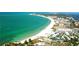 Aerial view of coastline, beach, and residential buildings at 2260 Stickney Point Rd # 303, Sarasota, FL 34231