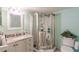 Bathroom with granite vanity, walk-in shower, and updated fixtures at 2260 Stickney Point Rd # 303, Sarasota, FL 34231