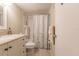 Clean bathroom with a shower/tub combo and vanity at 2260 Stickney Point Rd # 303, Sarasota, FL 34231