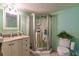 Bathroom with granite vanity, walk-in shower, and updated fixtures at 2260 Stickney Point Rd # 303, Sarasota, FL 34231