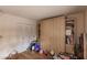 Guest bedroom with built-in wall bed and ample storage at 2260 Stickney Point Rd # 303, Sarasota, FL 34231