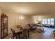 Bright dining area with granite-top table and chandelier at 2260 Stickney Point Rd # 303, Sarasota, FL 34231