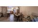 Open concept dining area with kitchen view and seating for four at 2260 Stickney Point Rd # 303, Sarasota, FL 34231