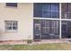 Back exterior view showing patio and screened enclosure at 2260 Stickney Point Rd # 303, Sarasota, FL 34231