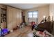 Home office with built-in shelving, desk, and hardwood floors at 2260 Stickney Point Rd # 303, Sarasota, FL 34231