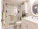 Updated bathroom with walk-in shower and white vanity at 2240 Stickney Point Rd # 213, Sarasota, FL 34231