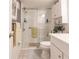 Updated bathroom with walk-in shower and white vanity at 2240 Stickney Point Rd # 213, Sarasota, FL 34231