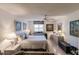 Serene bedroom with a comfortable queen bed and plenty of storage at 2240 Stickney Point Rd # 213, Sarasota, FL 34231