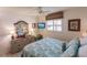 Bright bedroom with a comfortable queen-size bed and ample closet space at 2240 Stickney Point Rd # 213, Sarasota, FL 34231