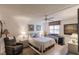 Cozy bedroom with a queen bed, and a home office area at 2240 Stickney Point Rd # 213, Sarasota, FL 34231