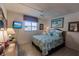 Bedroom with a queen-size bed and ocean-themed decor at 2240 Stickney Point Rd # 213, Sarasota, FL 34231