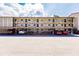 Condo building with covered parking and lush landscaping at 2240 Stickney Point Rd # 213, Sarasota, FL 34231