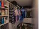 Large walk-in closet with ample shelving and hanging space at 2240 Stickney Point Rd # 213, Sarasota, FL 34231