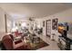 Spacious living room with comfortable seating and view to dining area at 2240 Stickney Point Rd # 213, Sarasota, FL 34231