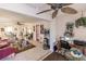 View of living room and home office with open floorplan at 2240 Stickney Point Rd # 213, Sarasota, FL 34231