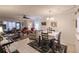 Open living and dining area with comfortable seating and a dining table at 2240 Stickney Point Rd # 213, Sarasota, FL 34231
